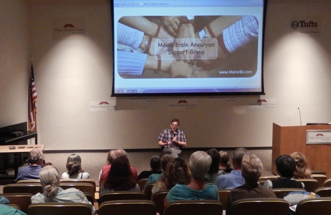 Jason Crigler speaking to brain aneurysm support group