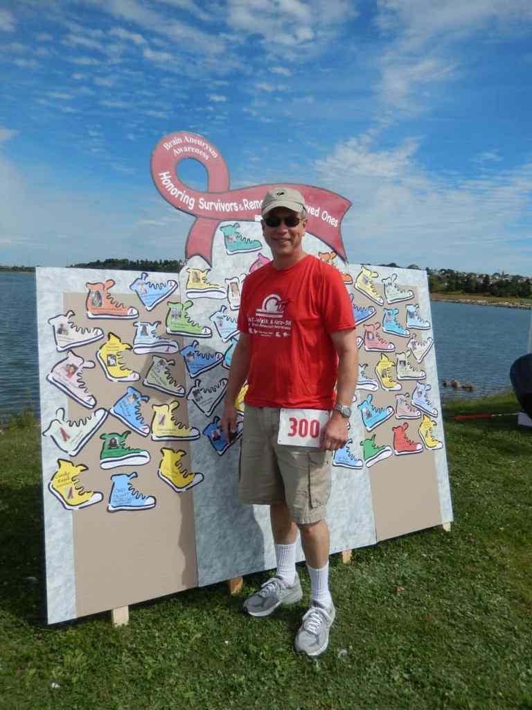 Survivor Peter Geiger at honor wall