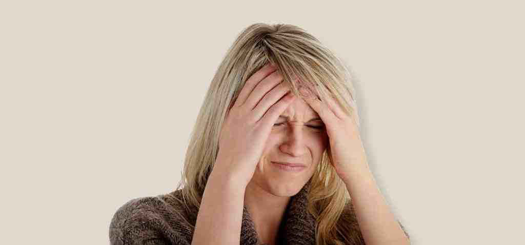 woman with headache possible brain aneurysm photo