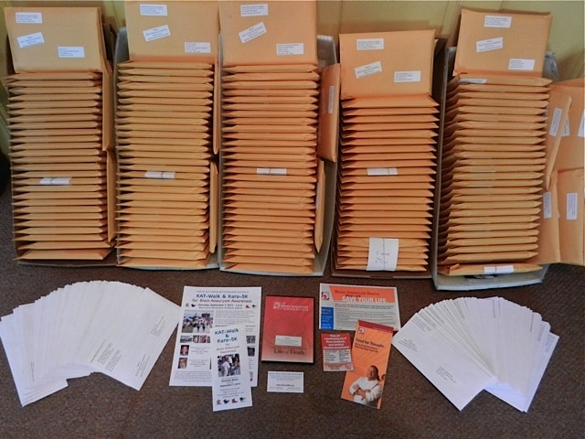 Stacks of mailer for brain aneurysm awareness