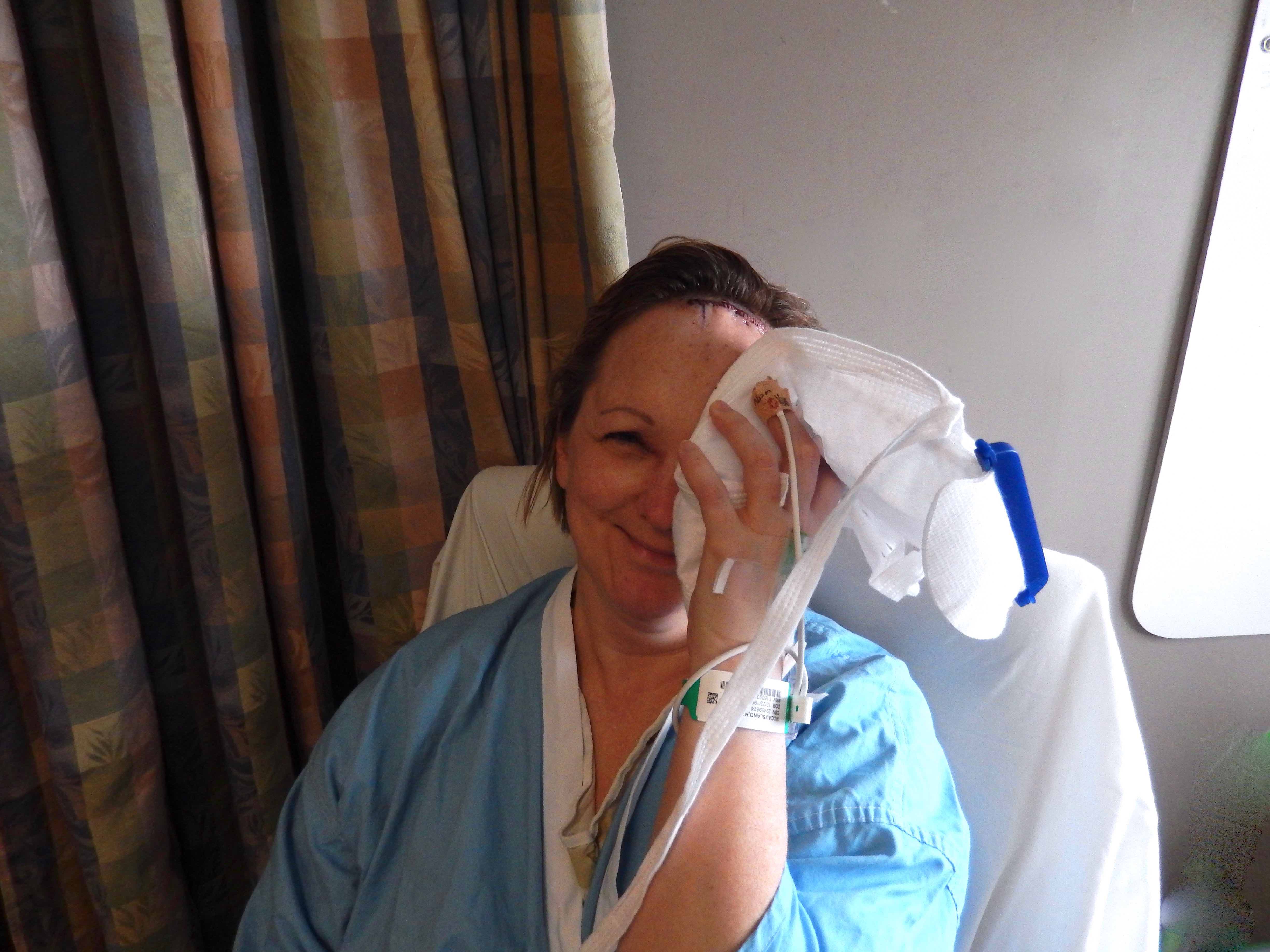 patient holding ice pack to face